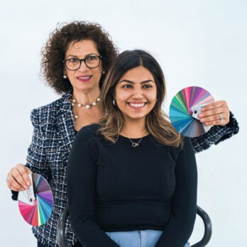 Ferial Youakim presenting the 4x4 Color Swatch to a smiling woman during a session on the fundamentals of color analysis.